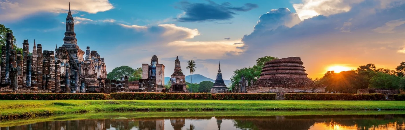 Ancient Thai temples at sunset